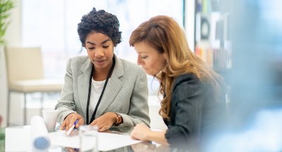 Two consultants reviewing documents together
